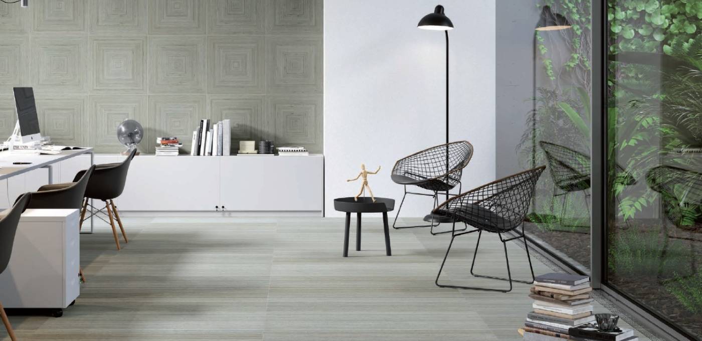 Glazed grey wood look porcelain floor and wall tile featured on floors and wall of office